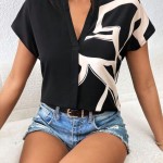 BLUSA CON ESTAMPADO CUELLO MUESCA MANGA MURCIÉLAGO