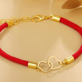 Pulsera con adorno de corazon entrelazado