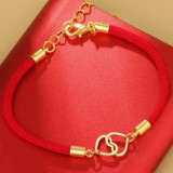 Pulsera con adorno de corazon entrelazado